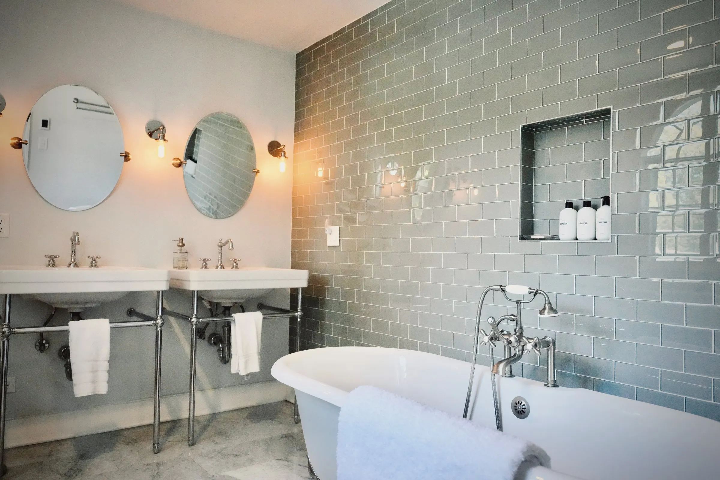 The big bath — clawfoot soaking tub, gray subway tile