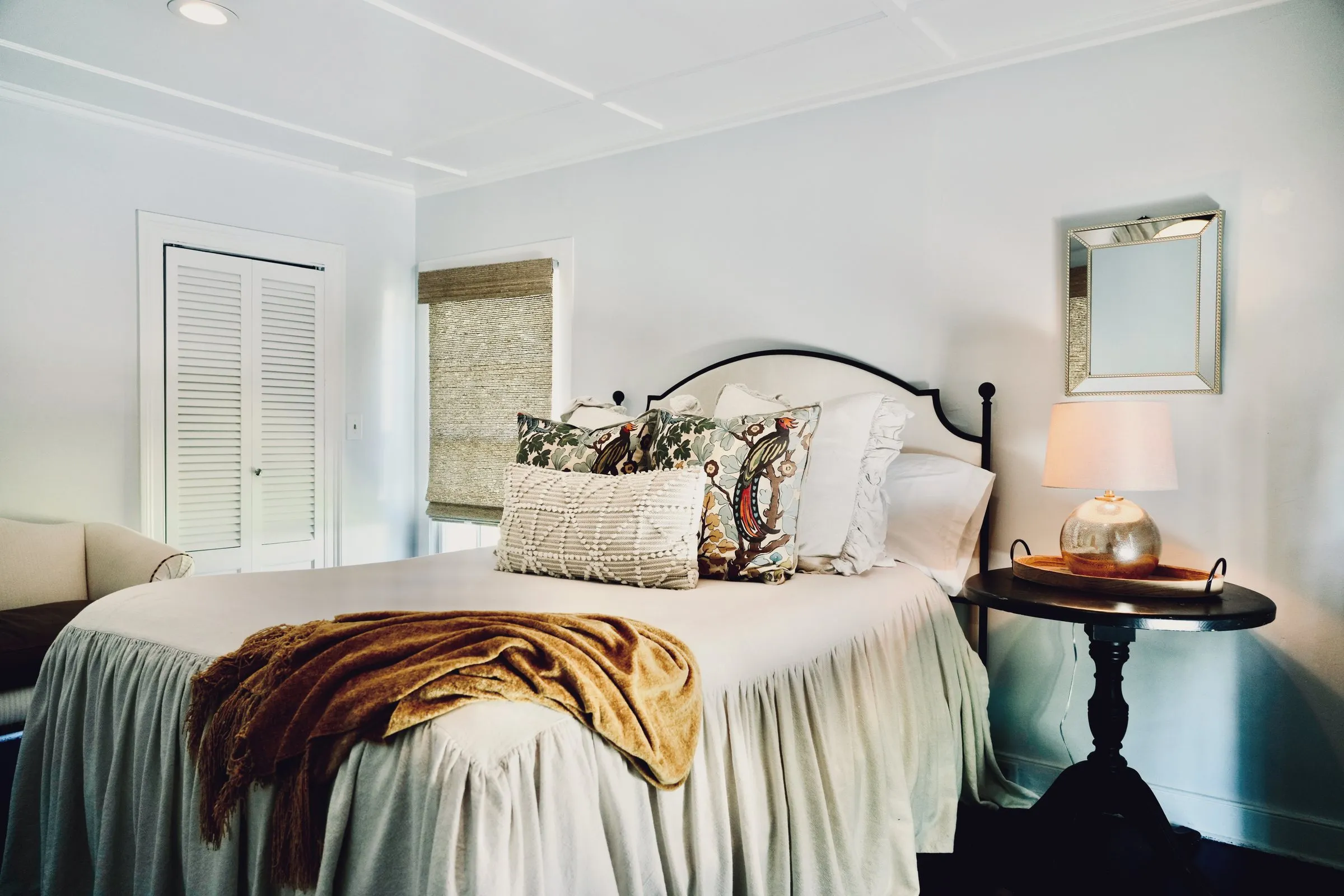 The primary bedroom — king bed, dressing room beyond