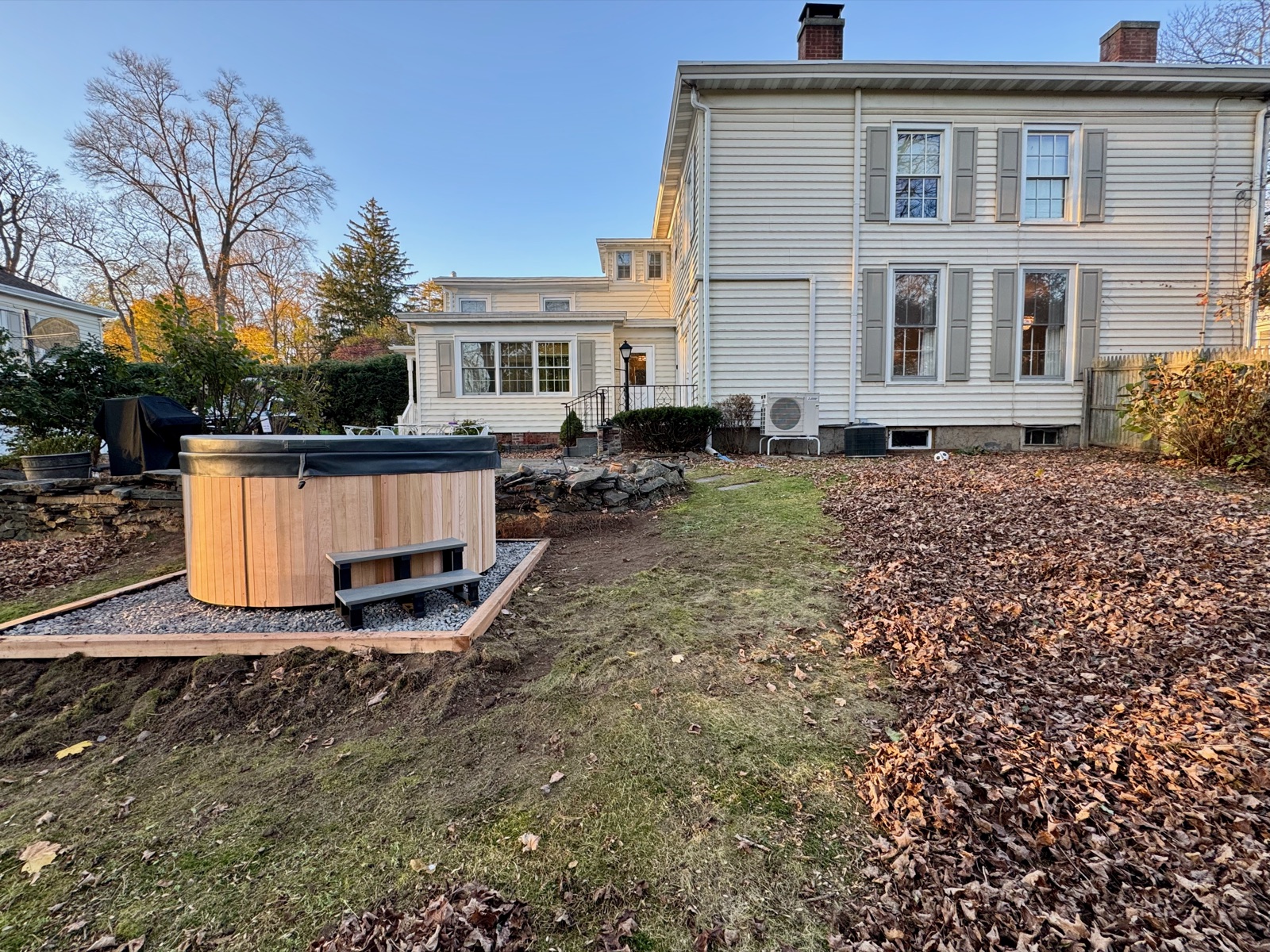 The tub, newly landed — the yard still catching up around it